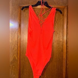 Orange Body suit from Dainty
